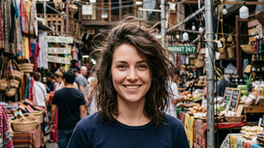Portrait photo with a busy market background, before background removal